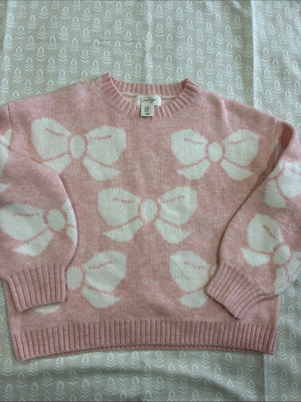 Jessica Simpson Pink Sweater with White Bow Motif
